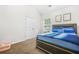 Cozy bedroom with double door closet, natural light and light brown carpet at 3492 Newtons Crest Cir, Snellville, GA 30078