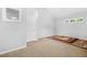 Spacious bedroom with neutral walls, carpet, and a small horizontal window at 3492 Newtons Crest Cir, Snellville, GA 30078