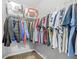 A filled closet featuring shelving, metal racks, and neutral carpet at 3492 Newtons Crest Cir, Snellville, GA 30078