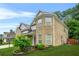 Lovely two-story brick home features a manicured lawn and side yard landscaping at 3492 Newtons Crest Cir, Snellville, GA 30078