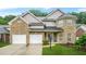 Charming two-story brick home with attached two-car garage and well-manicured lawn at 3492 Newtons Crest Cir, Snellville, GA 30078
