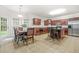 Large kitchen with a breakfast table and seating as well as stainless steel appliances at 3492 Newtons Crest Cir, Snellville, GA 30078