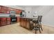 Kitchen boasts a large island, breakfast bar, and stainless steel refrigerator at 3492 Newtons Crest Cir, Snellville, GA 30078