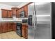 Well-equipped kitchen features stainless steel refrigerator and appliances at 3492 Newtons Crest Cir, Snellville, GA 30078