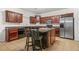 Spacious kitchen featuring granite counters, an island, and modern stainless appliances at 3492 Newtons Crest Cir, Snellville, GA 30078