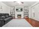 Charming living room featuring a fireplace and large built-in bookshelves at 3492 Newtons Crest Cir, Snellville, GA 30078