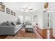 Inviting living room with hardwood floors, neutral paint, and plenty of natural light at 3492 Newtons Crest Cir, Snellville, GA 30078