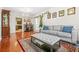 Comfortable living room with hardwood floors, a ceiling fan, and two sofas at 3492 Newtons Crest Cir, Snellville, GA 30078
