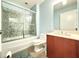 The bathroom has a mosaic tile shower and a modern vanity at 3655 Peachtree Ne Rd # 304, Atlanta, GA 30319
