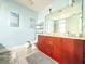 Bright bathroom features a double vanity, toilet and decorative art at 3655 Peachtree Ne Rd # 304, Atlanta, GA 30319