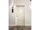 Apartment 304's white door with modern handle and wall sconce at 3655 Peachtree Ne Rd # 304, Atlanta, GA 30319