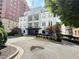 Charming building exterior featuring a circular driveway and attractive landscaping at 3655 Peachtree Ne Rd # 304, Atlanta, GA 30319