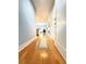 Inviting hallway leading into a bright kitchen with hardwood floors at 3655 Peachtree Ne Rd # 304, Atlanta, GA 30319