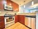 Bright kitchen featuring stainless steel appliances and stylish lighting at 3655 Peachtree Ne Rd # 304, Atlanta, GA 30319