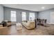 Elegant living room featuring light blue walls, modern furniture, and natural light at 3655 Peachtree Ne Rd # 304, Atlanta, GA 30319