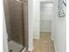 Bathroom featuring a tiled shower and walk-in closet with built-in shelving at 4540 Cold Spring Ct, Cumming, GA 30041
