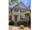 Beautiful brick townhouse with dark shutters and a charming front porch at 4540 Cold Spring Ct, Cumming, GA 30041