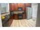 The kitchen features granite counters, wooden cabinets, and stainless steel appliances at 4540 Cold Spring Ct, Cumming, GA 30041