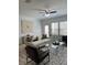 Bright living room features modern decor, neutral paint, and hardwood flooring throughout at 4540 Cold Spring Ct, Cumming, GA 30041