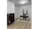 Bright office with hardwood floors, modern desk and shelving, and two decorative paintings at 4540 Cold Spring Ct, Cumming, GA 30041