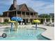 The community pool features fun mushroom fountains and ample seating at 4540 Cold Spring Ct, Cumming, GA 30041