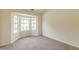 Bedroom features carpet flooring, a bay window, and natural lighting at 5680 Hampton Ct, Atlanta, GA 30349