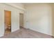 Bedroom with adjacent bath and closet, featuring carpet and neutral walls at 5680 Hampton Ct, Atlanta, GA 30349