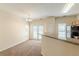 Cozy dining area with modern lighting, access to an outdoor patio, and a breakfast bar at 5680 Hampton Ct, Atlanta, GA 30349