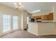 Bright kitchen with wooden cabinets, black appliances, and a breakfast bar perfect for casual dining at 5680 Hampton Ct, Atlanta, GA 30349