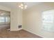 Cozy living room features neutral walls and carpet, with a window providing natural light at 5680 Hampton Ct, Atlanta, GA 30349