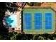 A stunning aerial view featuring a pool, lounge area, and tennis courts, surrounded by lush greenery at 2721 Maeve Ct, Dacula, GA 30019