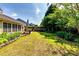 A sprawling backyard with lush green plants, and an irrigation system at 2721 Maeve Ct, Dacula, GA 30019