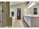 Neutral primary bathroom with double sinks, shower and soaking tub along with a large walk-in closet at 2721 Maeve Ct, Dacula, GA 30019