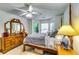 This bedroom features natural light, carpet, neutral paint and a ceiling fan at 2721 Maeve Ct, Dacula, GA 30019