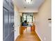 Inviting foyer with hardwood floors, neutral walls, and a view into the spacious living area at 2721 Maeve Ct, Dacula, GA 30019