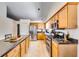 Well-equipped kitchen featuring stainless steel appliances, ample cabinet space, and granite countertops at 2721 Maeve Ct, Dacula, GA 30019