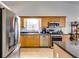 Modern kitchen showcases stainless steel appliances, and generous counter space for meal preparation at 2721 Maeve Ct, Dacula, GA 30019