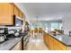 Open kitchen with a kitchen island, stainless steel appliances and a view to the dining room at 2721 Maeve Ct, Dacula, GA 30019