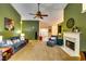 Open-concept living room with neutral carpet, a fireplace, and plenty of natural light at 2721 Maeve Ct, Dacula, GA 30019