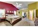 Large bedroom with vaulted ceilings and a view into a sitting room provides a private retreat at 2721 Maeve Ct, Dacula, GA 30019