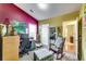 This home office features mixed paint, carpeted floors and natural light at 2721 Maeve Ct, Dacula, GA 30019
