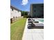Backyard patio showcasing lounge chairs with manicured lawn and fenced property lines at 4736 Landing Water Path, Buford, GA 30519