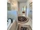 This bathroom features a tub, tiled shower, and an entry to the main bedroom at 4736 Landing Water Path, Buford, GA 30519