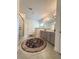 Bright bathroom with tile floors, shower, double sink vanity, and a decorative rug at 4736 Landing Water Path, Buford, GA 30519