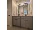 The bathroom features granite countertops, double sinks, and gray cabinets at 4736 Landing Water Path, Buford, GA 30519