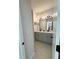 Bright bathroom featuring double vanity, gray cabinets, modern lighting, and tile flooring at 4736 Landing Water Path, Buford, GA 30519
