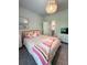 Bedroom features a TV, drawers, a bed, and a door leading to the bathroom at 4736 Landing Water Path, Buford, GA 30519