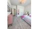 This bedroom features carpet, double closet and is decorated with pink accents at 4736 Landing Water Path, Buford, GA 30519