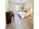 This well-lit bedroom features a piano, window and neutral tones at 4736 Landing Water Path, Buford, GA 30519
