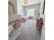 Well-lit bedroom featuring carpet, a window, decorative accessories, and a cozy daybed at 4736 Landing Water Path, Buford, GA 30519